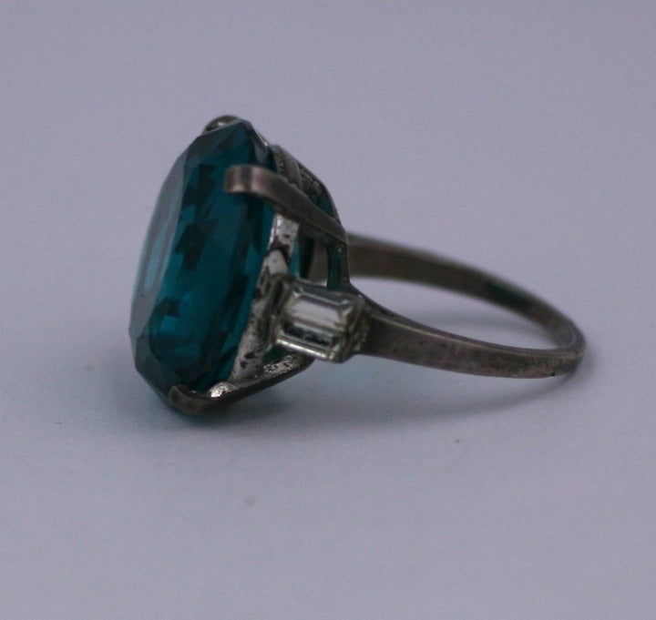 Huge cut stone cocktail ring in teal blue green with baguette detailed shoulders on the band. 1940's Sterling. Size 8-8.5