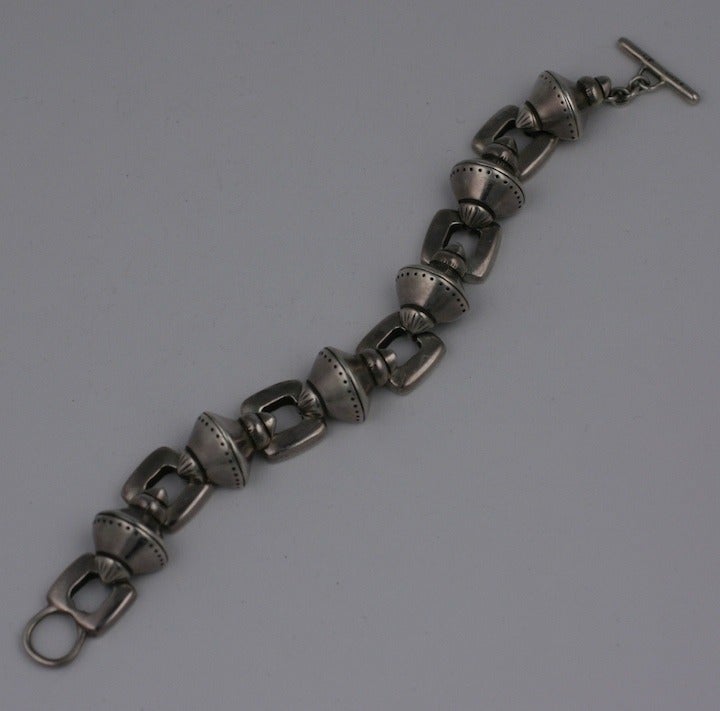 Lisa Jenk's heavy sterling link bracelet with dot-dash decoration, slightly 50's in feel but 80's in scale. 7.5