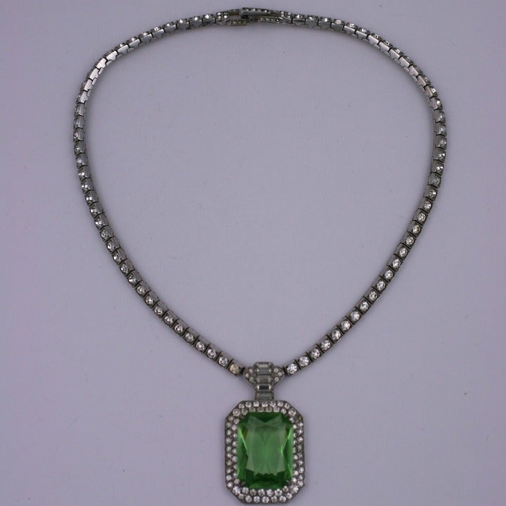 Large art deco pendant of flexible sterling set links with pastes and large central faux peridot drop. 1930's USA. 15