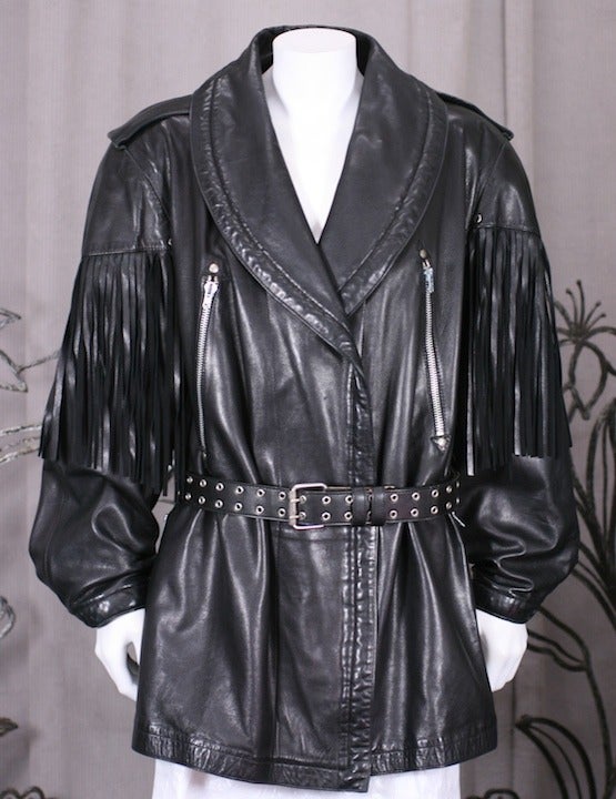 Claude Montana Moto Jacket with long fringe detailing falling from shoulder and back yoke. Double breasted with oversized shawl collar and long silver zipper ornamentation. The original belt is missing and needs one to stay closed. A simple leather