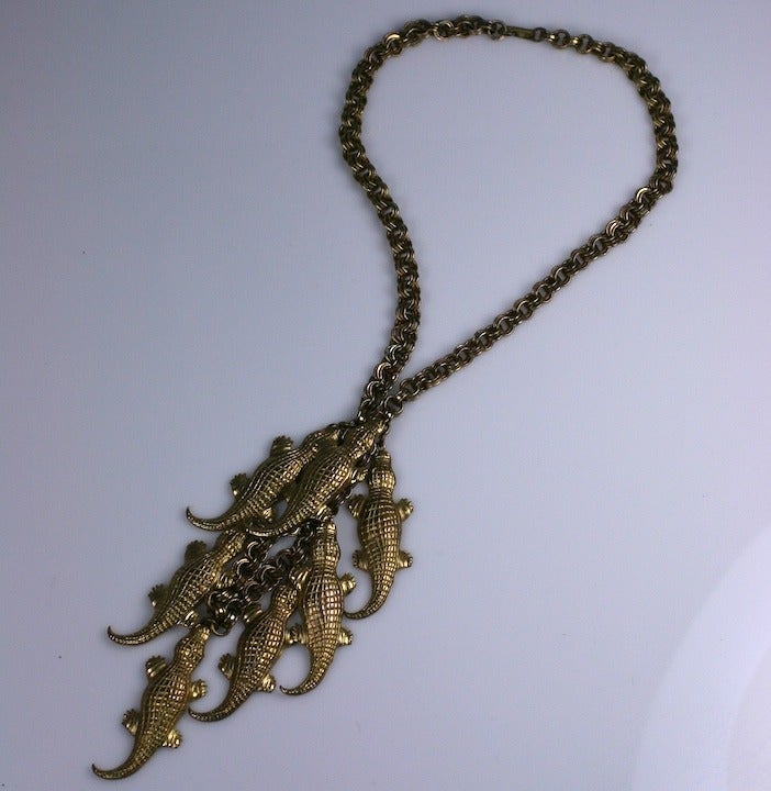 Very large and amusing pendant necklace suspending a gaggle of gators in gilded metal. 1960's USA. Excellent condition. 24