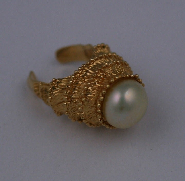 Carven signature Florentine gold and faux pearl stepped Temple ring, circa 1960.
 Carven was famous for their costume jewelery in the 1950s thru 1960s in signature florentine finish with enamel and faux stones.
France 1960's Excellent condition.