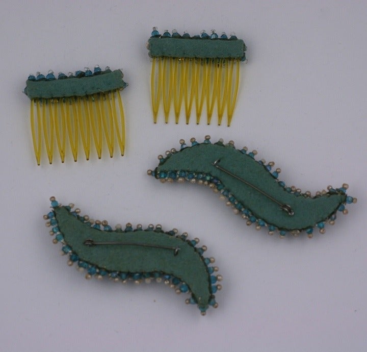 Unusual suite of matching hair combs and brooches. French in origin with lavishly hand embellished beads, rhinestones and faux pearls on felt bases. Brooch 3.25