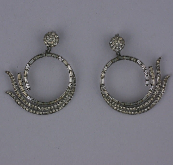 Elegant Trifari earclips from the 1950's. Pave and baguette rhinestones are used in this drop hoop with clip back fittings. Beautiful quality as to be expected from Trifari. 2.25