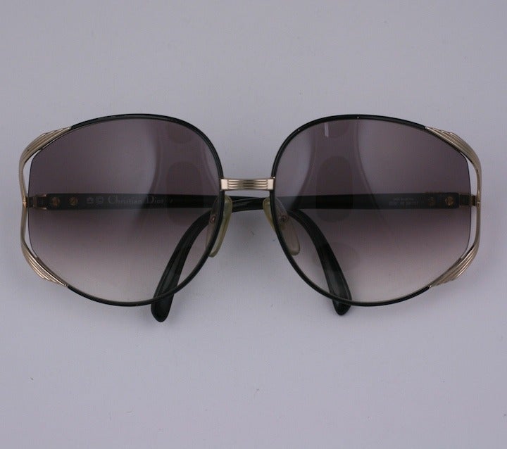 Glamorous Dior logo gradient sunglasses from the 1970's. Lenses appear to be floating, held by gilded ribbed supports with 