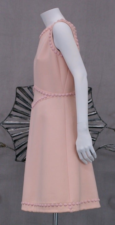 Andre Courreges Haute Couture Mod pale pink wool appliqued dress, mid 1960s. Utilizing signature Courreges seaming and signature embroidery applique. Excellent condition, 1960's France.
length 38 