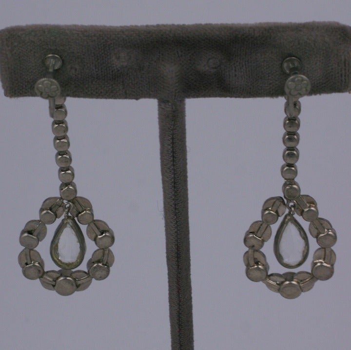 1920 long drop earrings in the Revivalist style of marcasites and faceted crystal  pear shaped paste interior drops. Set in silver metal with screw back fittings.
 Excellent condition.