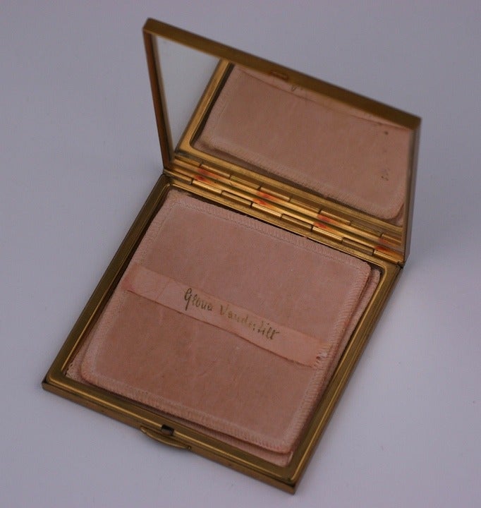 Charming Gloria Vanderbilt vintage powder compact which contains original puff. 