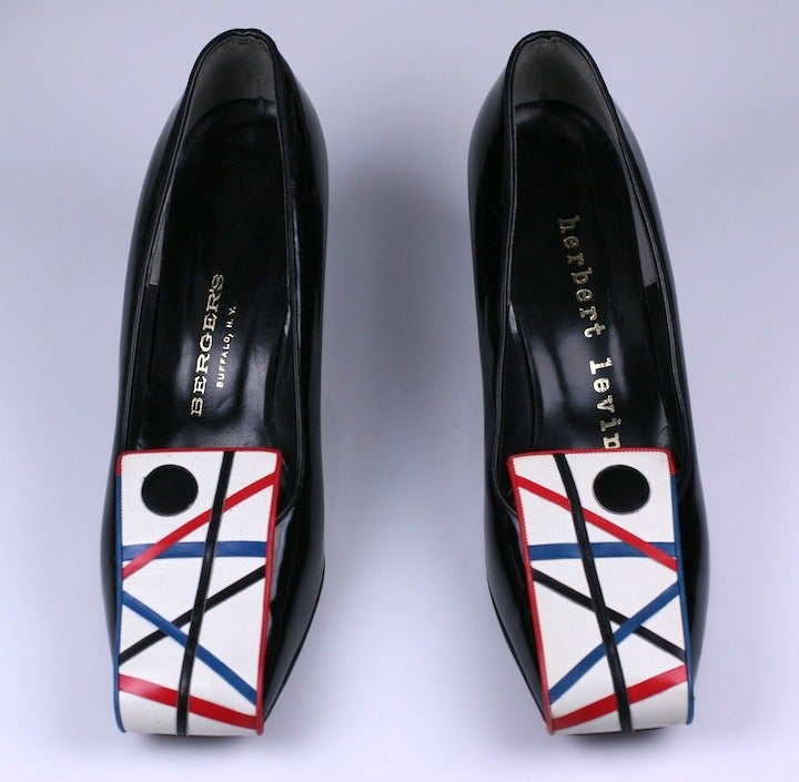 Rare Mondrian inspired shoes by Herbert Levine. Large Pop Art decorated panels of leather turn over the toe on this otherwise sedate pump. The heel is covered in the same blue leather of the design. Vintage size 7B. 1960's USA. Excellent condition.