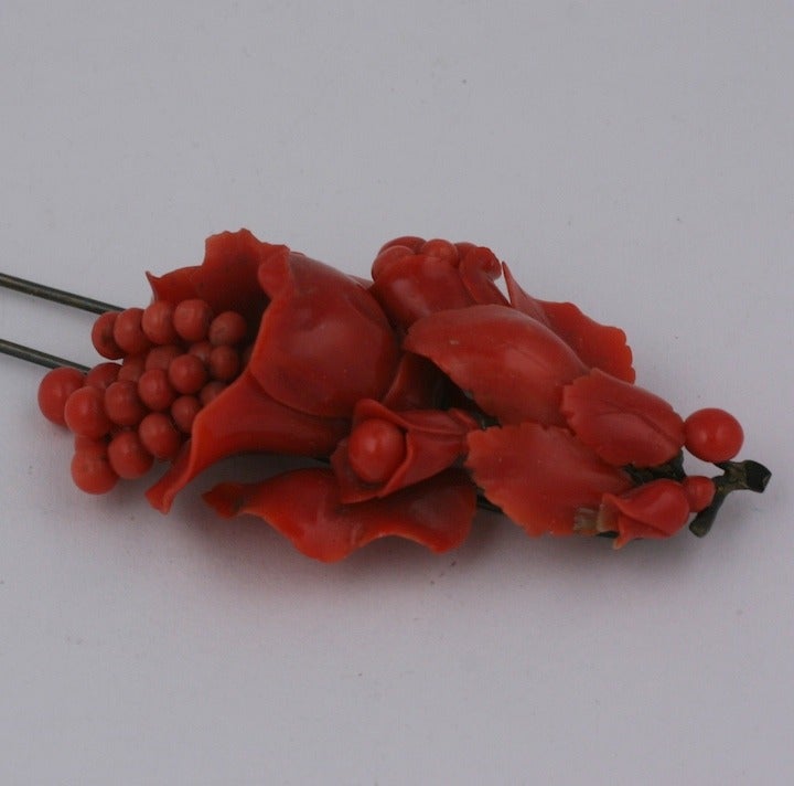 Exceptional mid 19th Century carved coral hair pick with richly carved lilies spitting coral tassels, leaves and berries. Mid 19th Century, Italy. Very Good Condition and rich deep coral color, untreated. 4