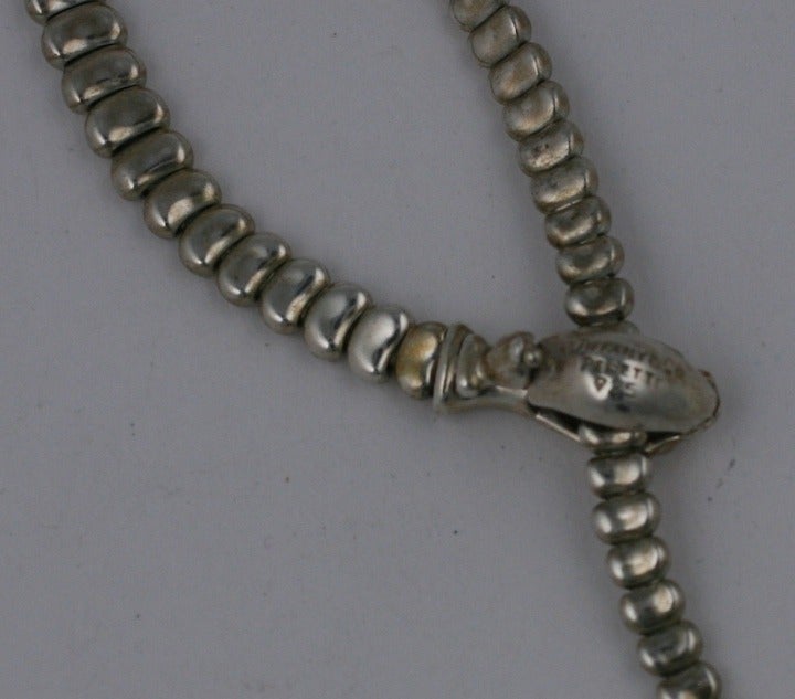 Early Vintage Elsa Peretti for Tiffany & Co. sterling serpent necklace. Amazing design and quality produced by Peretti in the 1970's. 
The head acts as the clasp and holds the tail at the desired length when worn. Fully articulated and designed