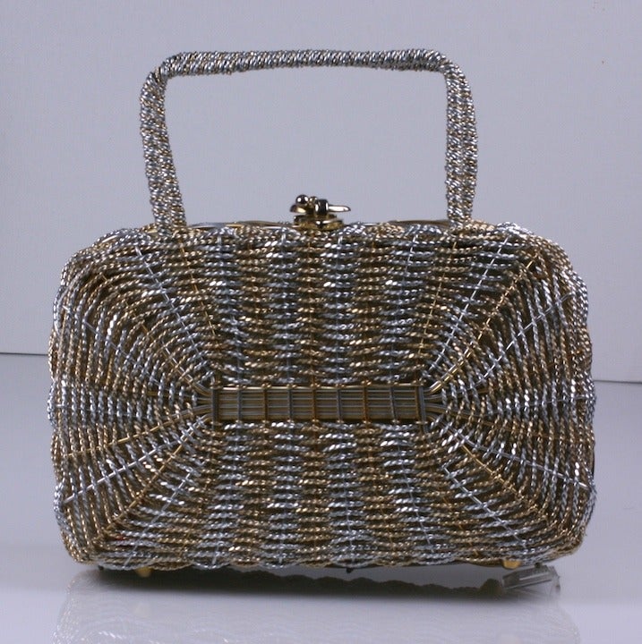 Hard purse by Koret USA. Hand woven in Italy of gold and silver toned metal wires and lined in gold leather.   8