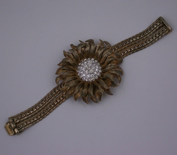 Nettie Rosenstein flexible Flower Cuff from the 1940s of gold washed sterling silver and crystal pave. Heavy quality with beautiful detailing. 7