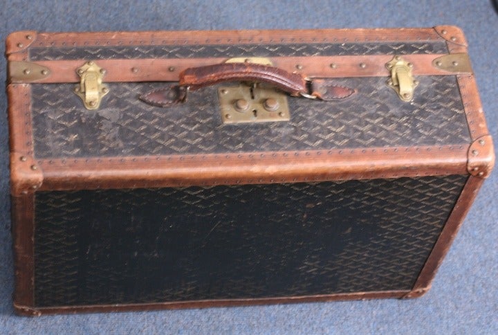 Maison Goyard Suitcase from the early 20th Century. This heritage house is the oldest manufacturer in France. Signature logo textile, leather bound with original signed hardware and lovely patina. 1920's France. Very Good Condition.  
24