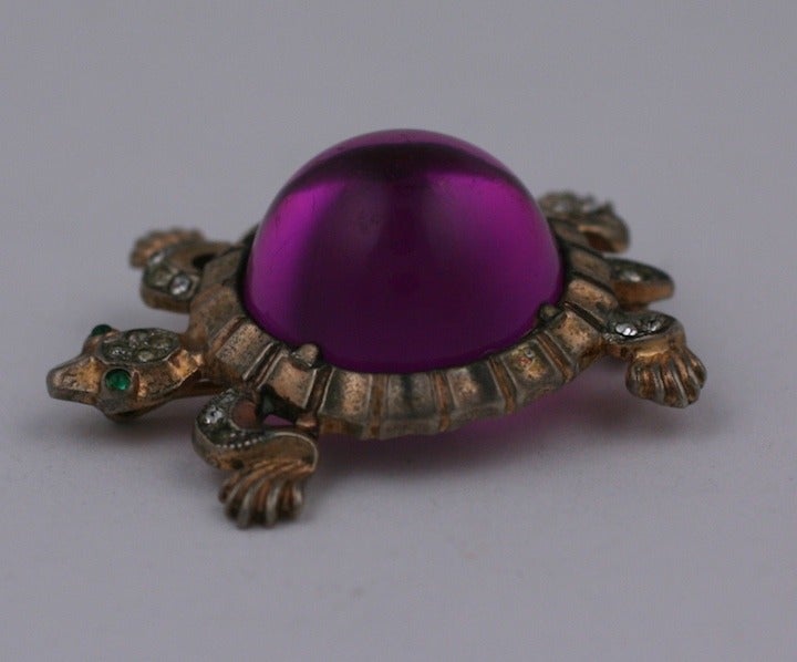 Rare gold washed sterling silver Trifari purple lucite Jelly Belly brooch. Retro style with emerald cabochon eyes and crystal pave, 1940's. 1.50