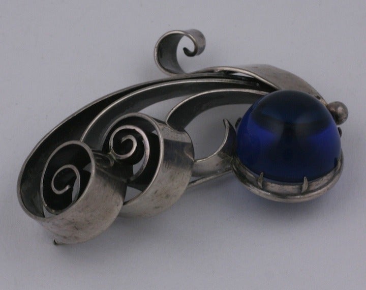 Unusual silvered metal and faux sapphire atomic coiled retro style brooch,
by Joseff of Hollywood. 1940's USA. 2.25