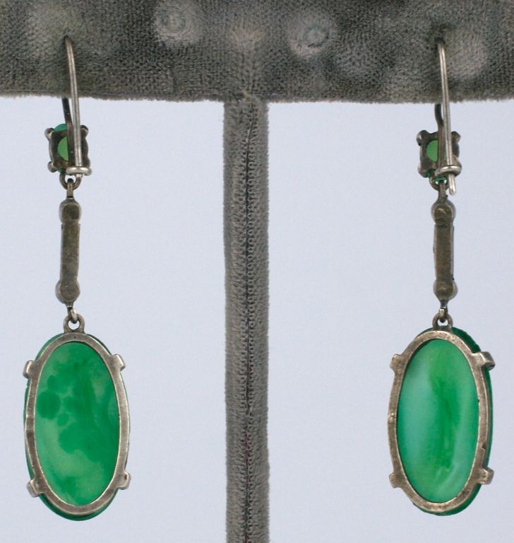 Lovely deco paste drop earrings set in sterling with pastes and faux jade cabochons circa 1930s.<br />
1.75" long<br />
.5" Wide