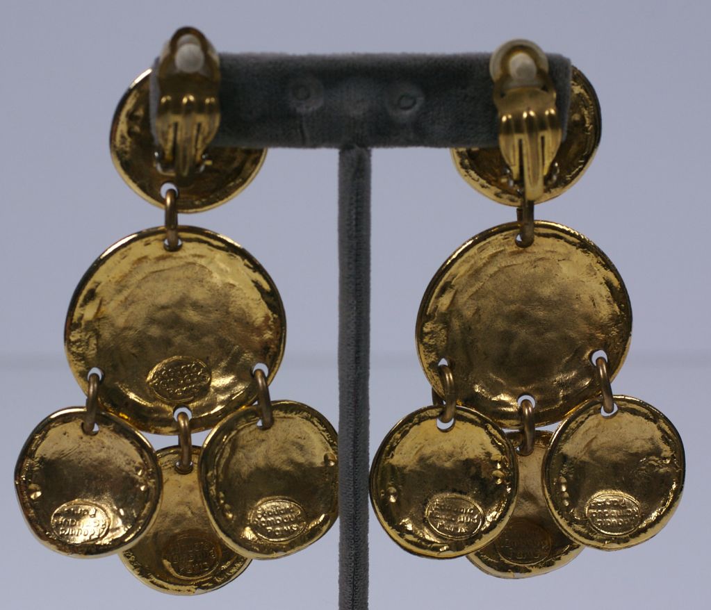 Dramatically scaled runway gold disc earrings by Edouard Rambaud, Paris. Clip back fittings circa 1980s.<br />
Excellent condition.<br />
3.5" x 2.25" W.