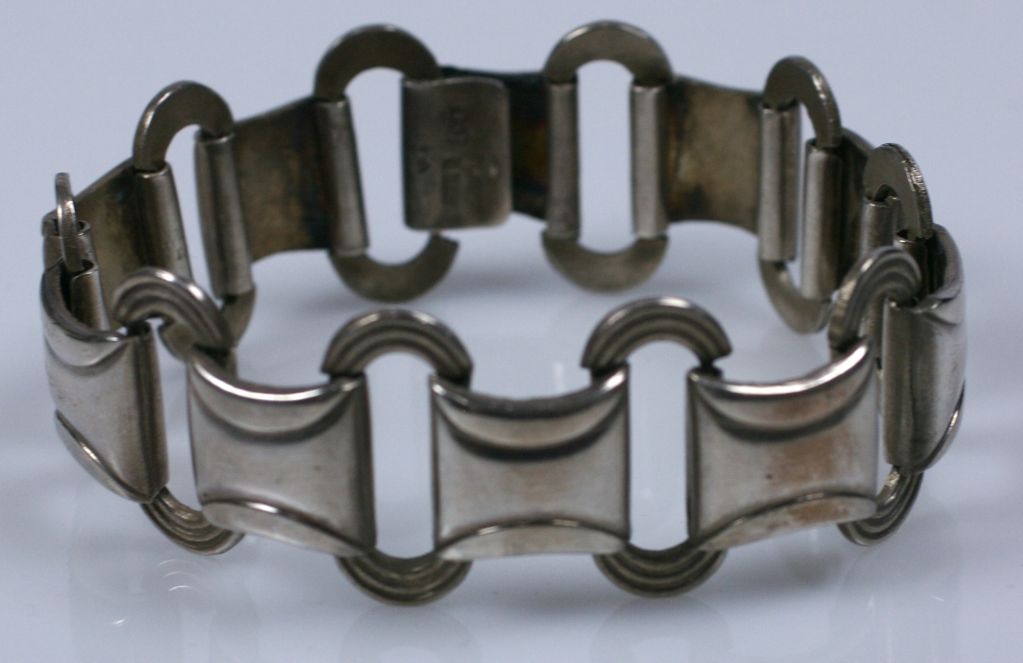 Retro moderne unisex swedish sterling link bracelet from the 1930s. Classic hook and bar closure. Hallmarked on clasp with silver standards.<br />
7.5