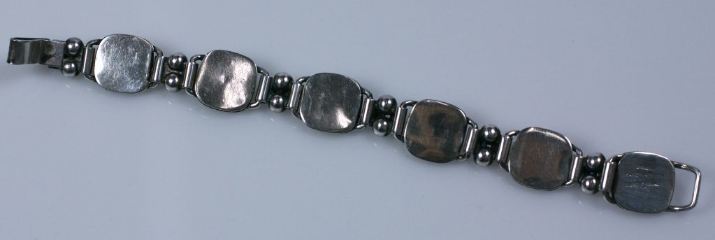 Handmade Arts And Crafts style Georg jensen sterling link bracelet. Dogwood style flowerheads mixed with ball link spacers circa 1950s. <br />
Marked 