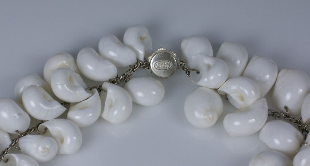Rare Miriam Haskell necklace composed of dozens of lustrous natural white snail shells. Large imposing necklace with a great look for summer.<br />
Signature beaded Haskell clasp.<br />
Excellent condition<br />
Total Length: 36"