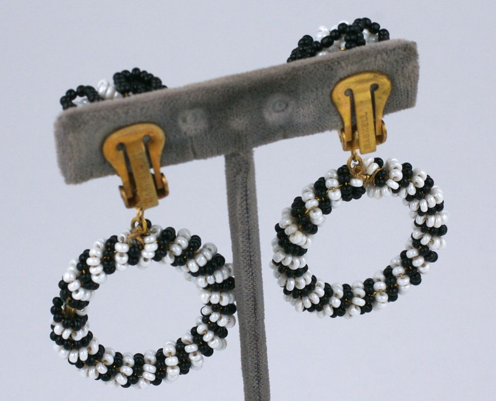 Miriam Haskell hoop earrings of black and white beads with clip back fittings. 1960s. <br />
2.5