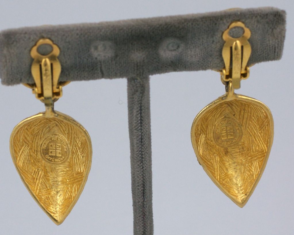 Givenchy hammered gold teardrop earrings. 1980s.<br />
Clip back fittings.<br />
2.25