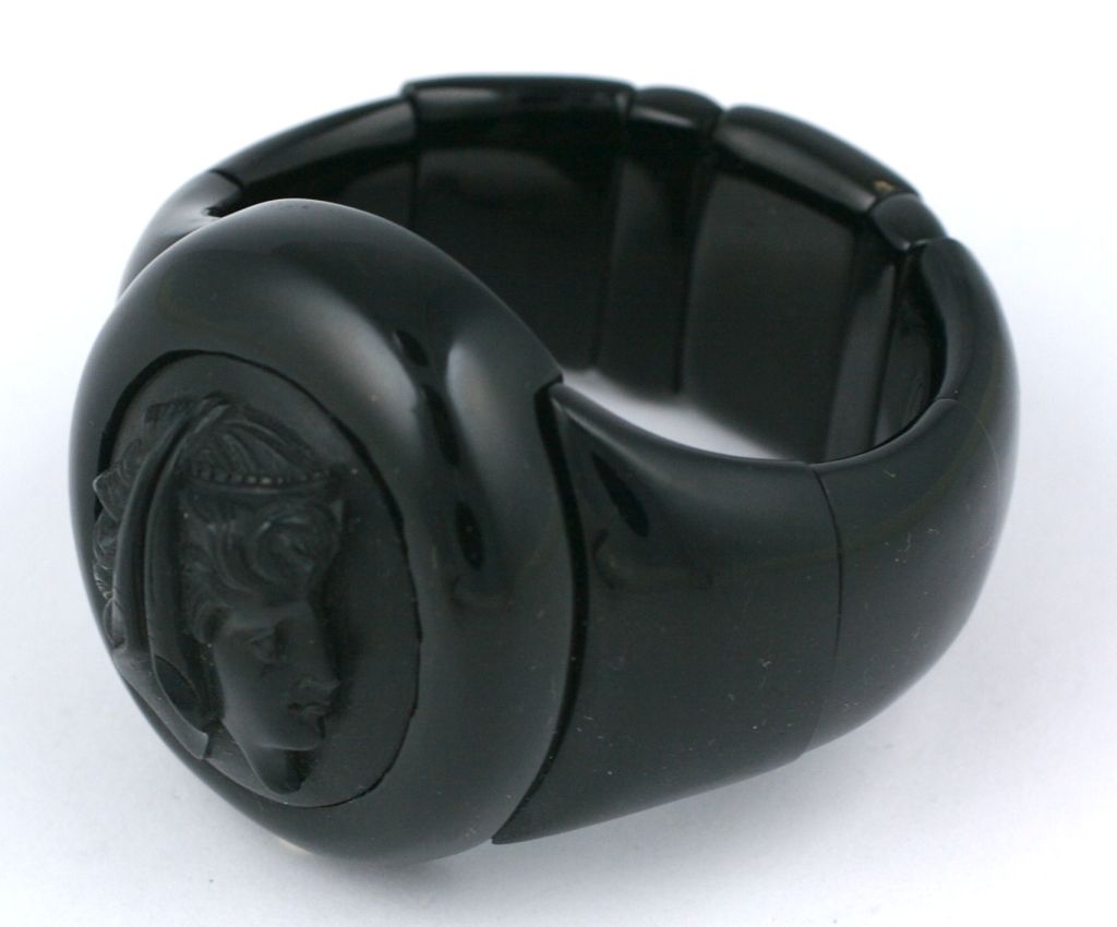 High relief carved victorian bracelet of whitby jet. Strung on elastic. Lovely carved cameo of goddess circa 1870s.

1.75
