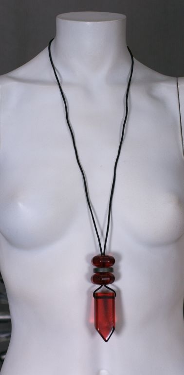 French red faux crystal shard necklace suspended from a leather cord, with two octagonal red and one silver bead enhancers. Labelled Made in France.<br />
New Unworn<br />
Cord 30"<br />
Pendant 3 3/4"