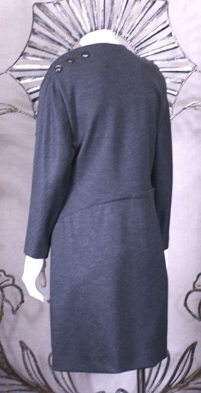 Geoffrey Beene chic charcoal wool jersey dress with unusual seaming. Triple button motif at hip and shoulder. Buttons open at hip for pocket entry. Buttons upon at shoulder for head entry. No size label, approx 6-8 US. 
Excellent condition. 
34