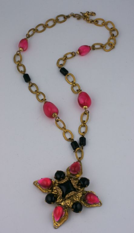 Wonderful french necklace/brooch combination in gilded metal with pate de verre glass and resin beads. Goossens quality. <br />
France 1950s.   3.25