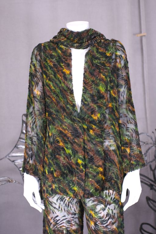 Halston silk chiffon and cut velvet pant suit with ubiquitous Halston flowing scarf/sash. The velvet areas have shiny lurex highlights and the print is reminiscent of a abstract camoflage print. Completely sheer, unlined with no closures on