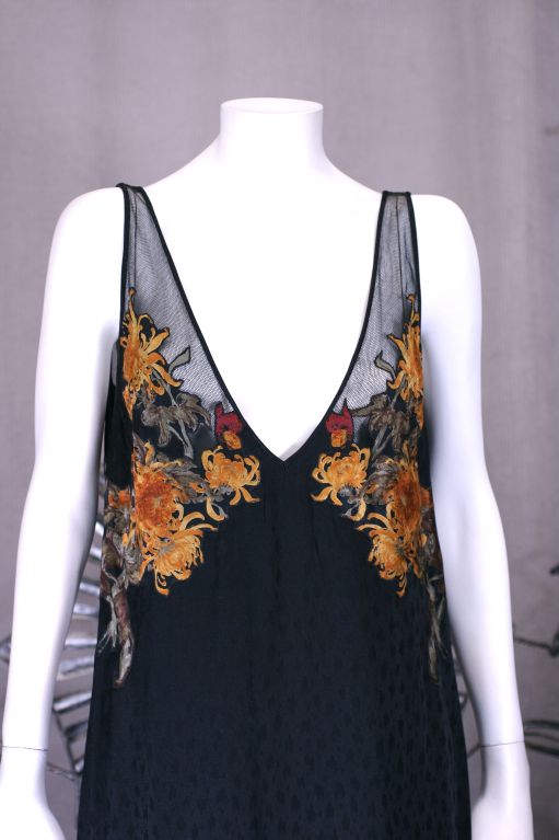Sexy slip dress by Luciano Soprani for Basile,Italy 1980s. Black silk jacquard is meshed to the cotton tulle straps with the overapplication of printed silk crysanthemums. Flowers are artfully placed around bust and to the back as well. Deep side