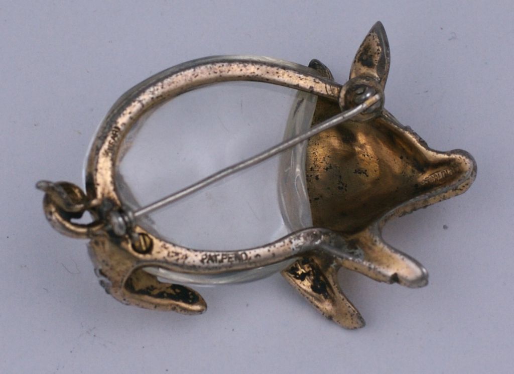 Trifari retro Jelly Belly amusing pig brooch. Designed in 1943 by Alfred Philippe ,this amusing pig brooch is one of the more unusual of Trifari's animal JELLY BELLY series. Set in gilt sterling.                      
Measurements 2.1/8