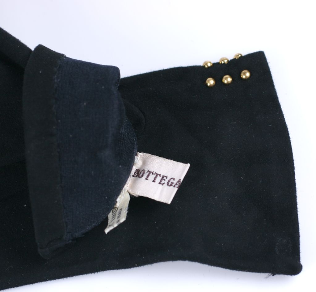 Buttery soft black suede gloves edged in gilt studs.<br />
Size 6<br />
Excellent condition