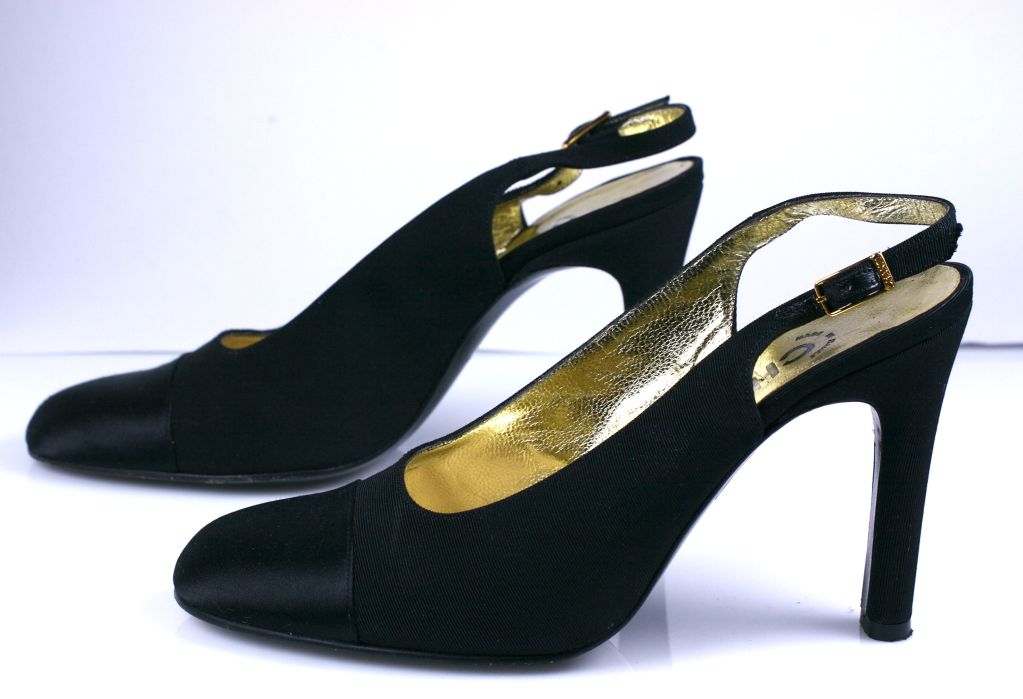 Chanel silk faille and satin toe sling back pumps in black. Gold kid lining 1990s.<br />
Excellent condition<br />
Size 37