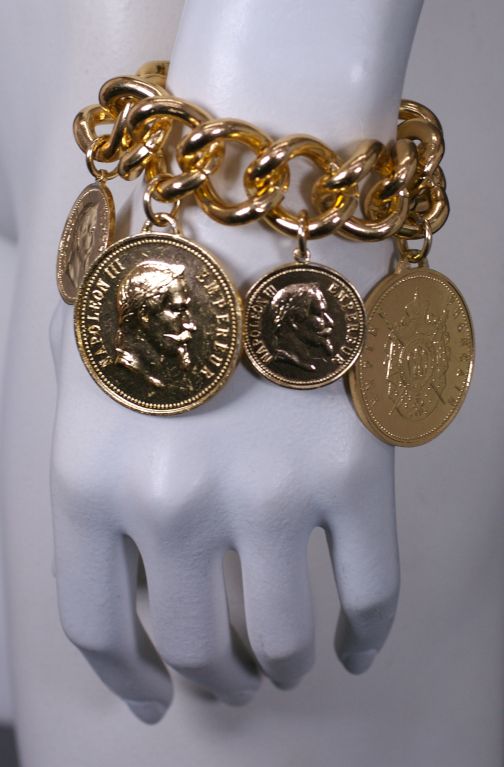 Great looking overscaled french coin charm bracelet with Napoleanic charms.1980s.<br />
Excellent condition.<br />
8" length, Charms 1" to 1.5"