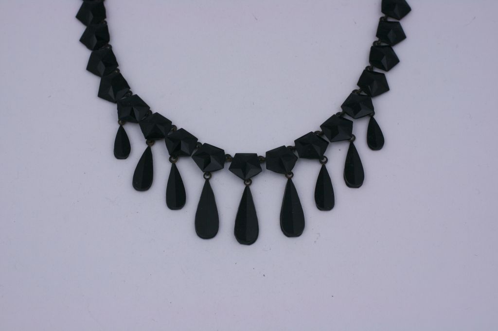 Victorian jet collar from the late 19th Century. Beautifully  faceted hexagonal links with teardrop shaped jet pendants. Set in japanned metal. Soft faceted sheen.<br />
Excellent condition. No chips.<br />
15