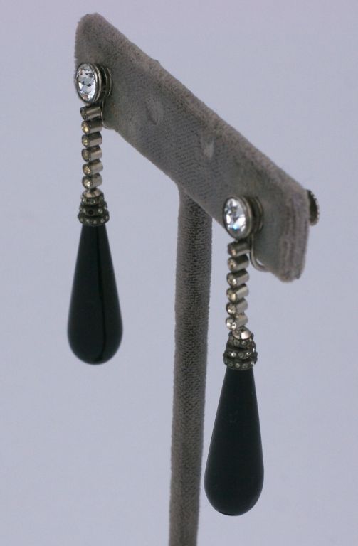 Fine french art deco paste and onyx drop earrings.Screw back closures with matched onyx long drops and stepped paste caps suspended from six bezel set articulated pastes.<br />
French silver hallmarks  2.25