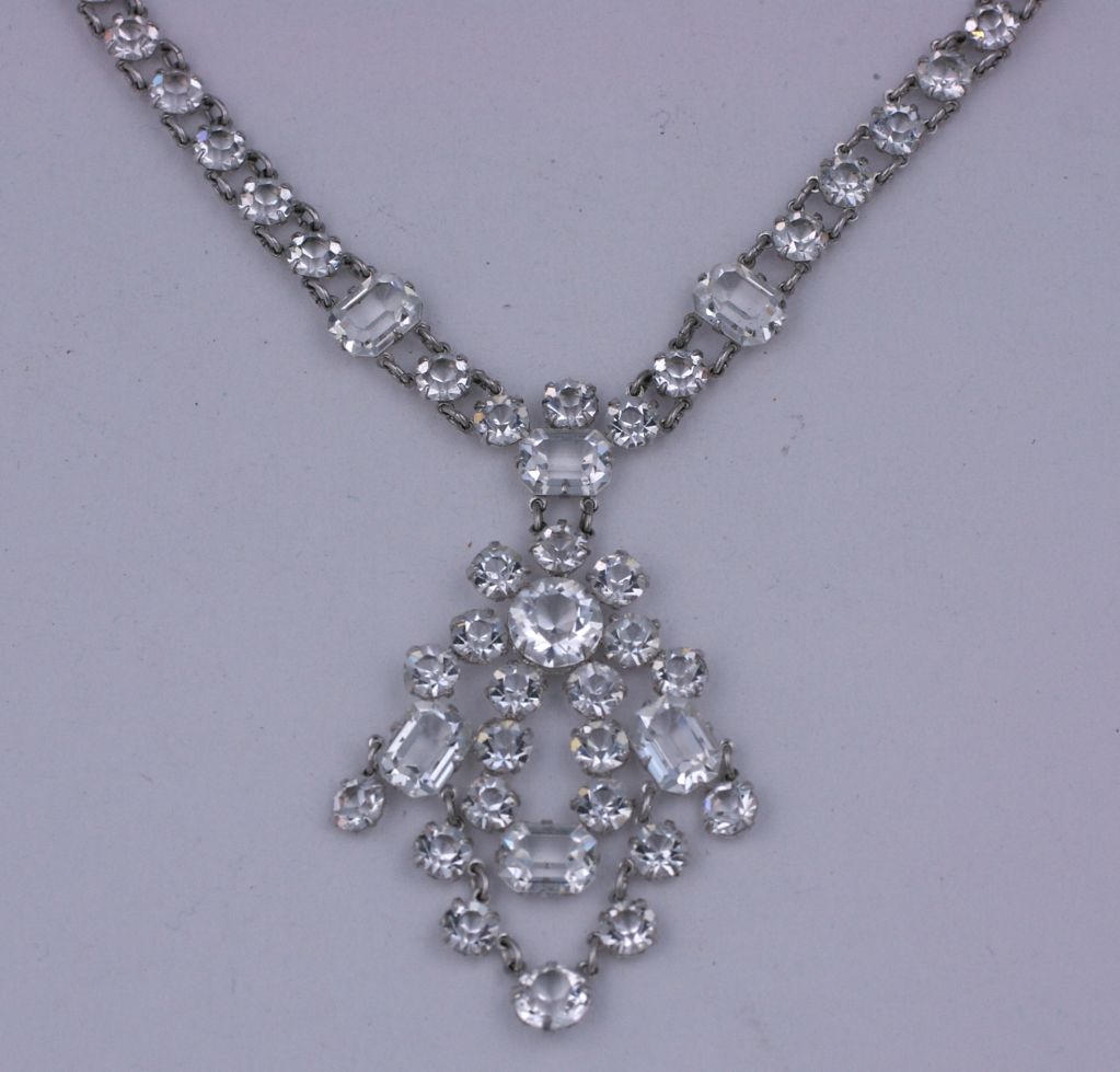 Lovely open backed crystal necklace from the 1920s. An articulated drop of various shaped stones falls from the 15