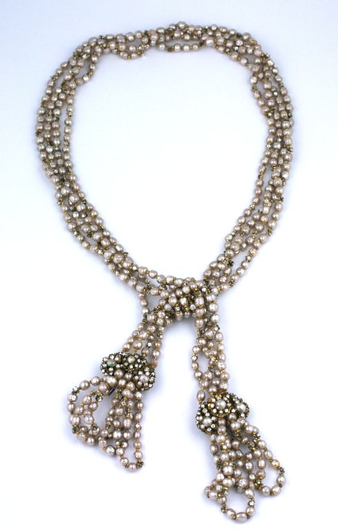 Miriam Haskell pearl and rose montes four strand lariat, terminating in looped pearl tassle double clips. Circa 1950s.<br />
Excellent condition<br />
<br />
34