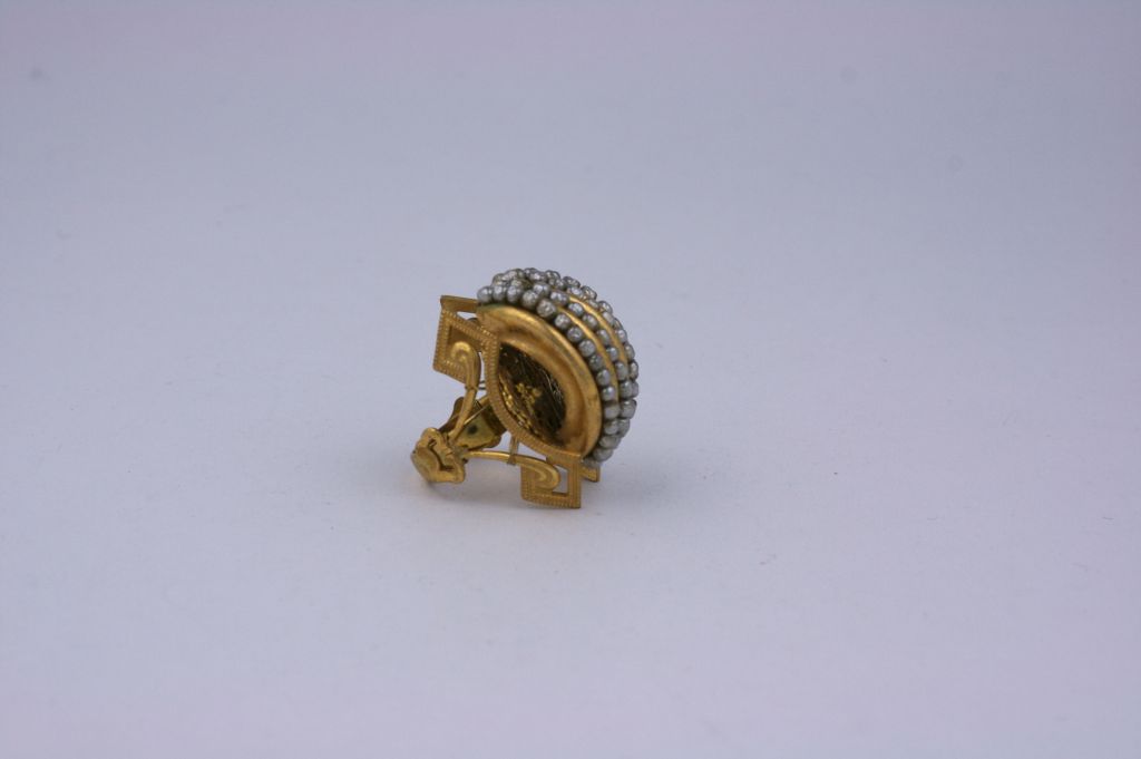 Miriam Haskell rare gilt metal cocktail ring of signature Russian gilt with faux pearl channels, side mounts in the Victorian Revival taste.<br />
Excellent condition<br />
1.5