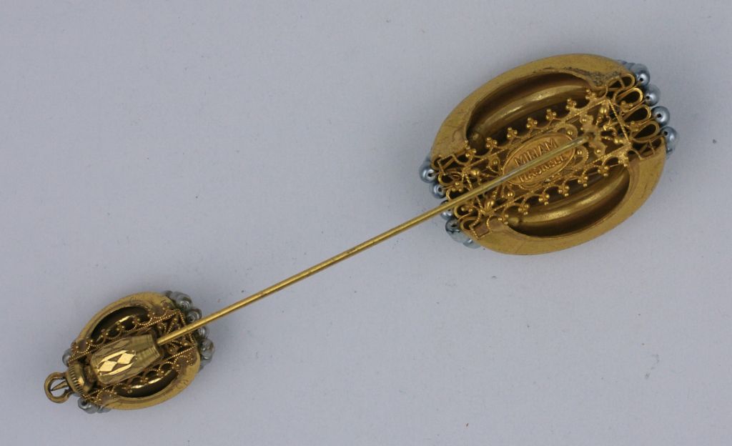 Miriam Haskell Double sided, 2 tone faux pearl stick pin. 1940's USA. Signature Russian gold finish. Excellent condition. 
4" x 1.5"  
