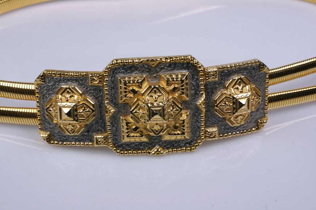 Unusual stretch belt of gilt snake chain with oversized belt clasp. Snake chain stretches to fit 26-30