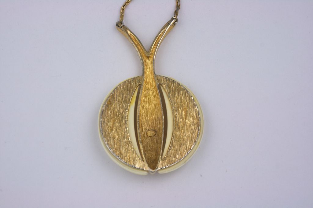 Grosse bakelite and gilt metal abstract fruit pendant. Ivory bakelite striking pendant. 1970s.<br />
Excellent condition.