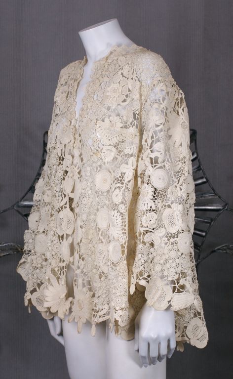 Hand made Irish crochet jacket from the end of the 19th Century. Fully cut body and sleeves with intricate traditional patterns of flowers, buds,vines and leaves. Extraordinary craftsmanship.<br />
No Closures<br />
Excellent condition