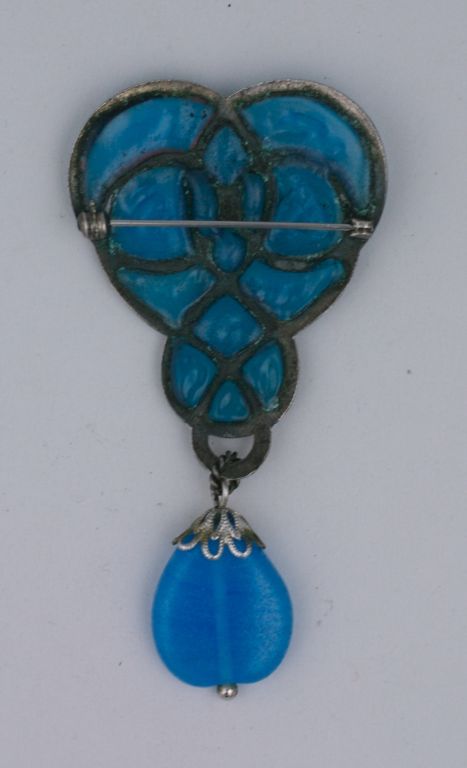 Art Nouveau style brooch of aqua poured glass. Silver gilt with pate de verre pear shaped drop.<br />
Christian Dior, unsigned.<br />
Excellent<br />
3.5