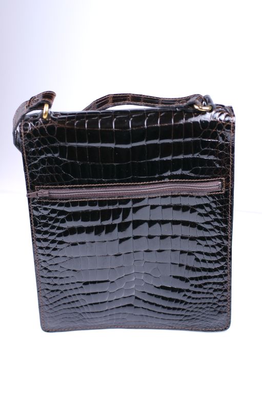 Attractive Bally center cut shoulder bag in deep brown center cut crocodile. Flap closure with exterior pocket and back zip pocket.  Excellent condition circa 1970s..<br />
Great for men or women.<br />
8