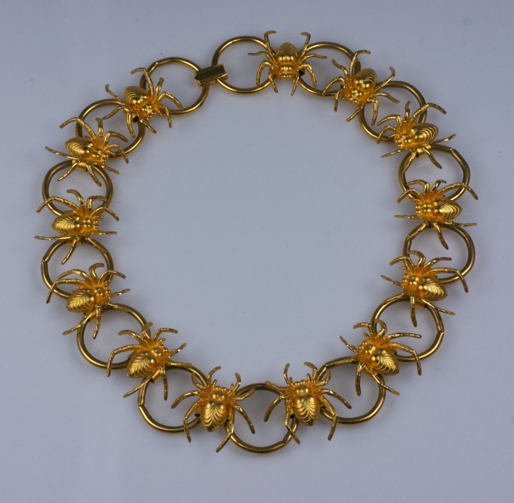 Surrealist spider necklace from the 1980s with gilt spiders connecting large circular links. 16