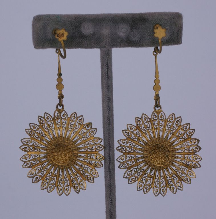 Gilded Brass filigree earrings from the late 19th Century. Screw back fittings with a sunflower motif popular in the period.<br />
Excellent codition<br />
3" x 1.5"